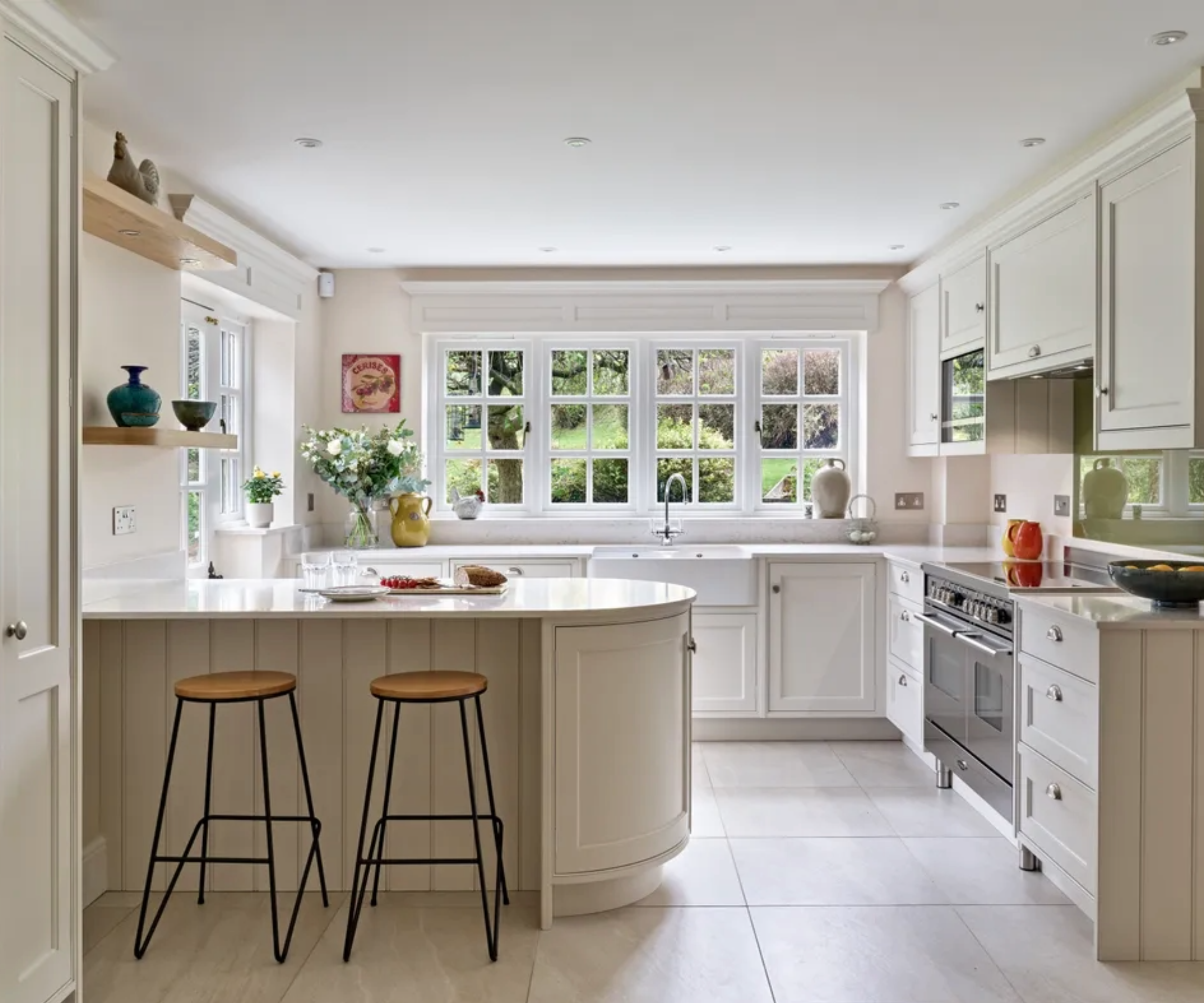 cream Shaker kitchen with curved kitchen island and large format floor tiles