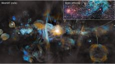 An image of the Milky Way captured by the MeerKAT radio telescope. At the center of the MeerKAT image the region surrounding the Milky Way&rsquo;s supermassive black hole blazes bright. Huge vertical filamentary structures echo those captured on a smaller scale by Webb in Sagittarius C&rsquo;s blue-green hydrogen cloud. 