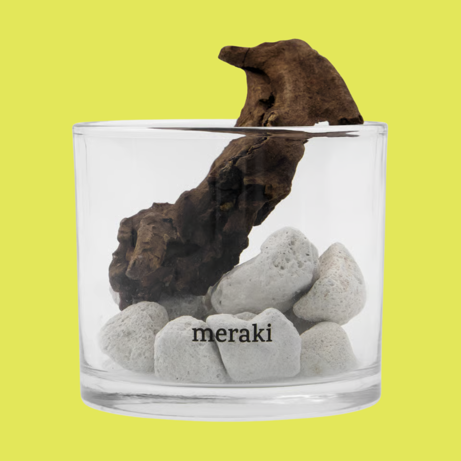 A glass with lava rocks and a wood chunk