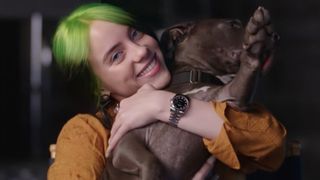 Billie Eilish's dog Shark being held by the singer