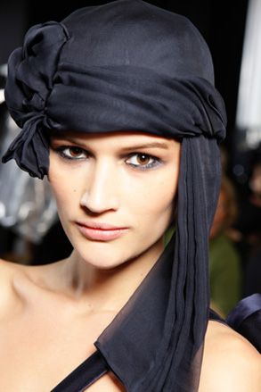 Smoky eyed model wearing dark turban
