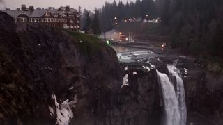 The exterior of the Great Northern Hotel, on the the cliff above a waterfall in Twin Peaks