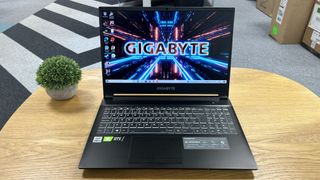 best 15-inch laptop Gigabyte G5 on a round coffee table