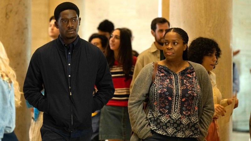 Damson Idris as Franklin Saint and Michael Hyatt as Cissy Saint walking through the museum in Snowfall season 6