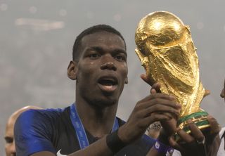 Paul Pogba with the World Cup trophy