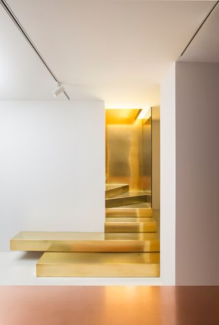 Glittering brass staircase