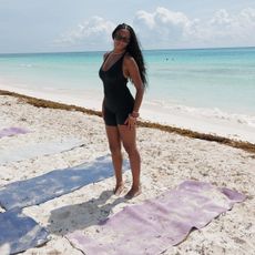 woman wearing activewear on the beach