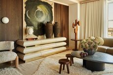 a living room with a large area rug