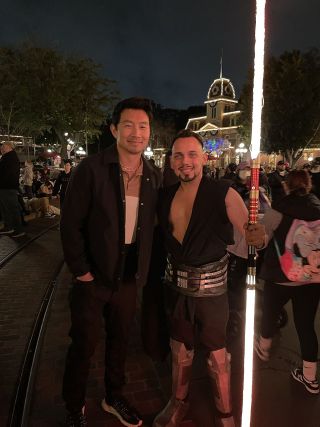 Simu Liu with fan Roger Stark at Disneyland