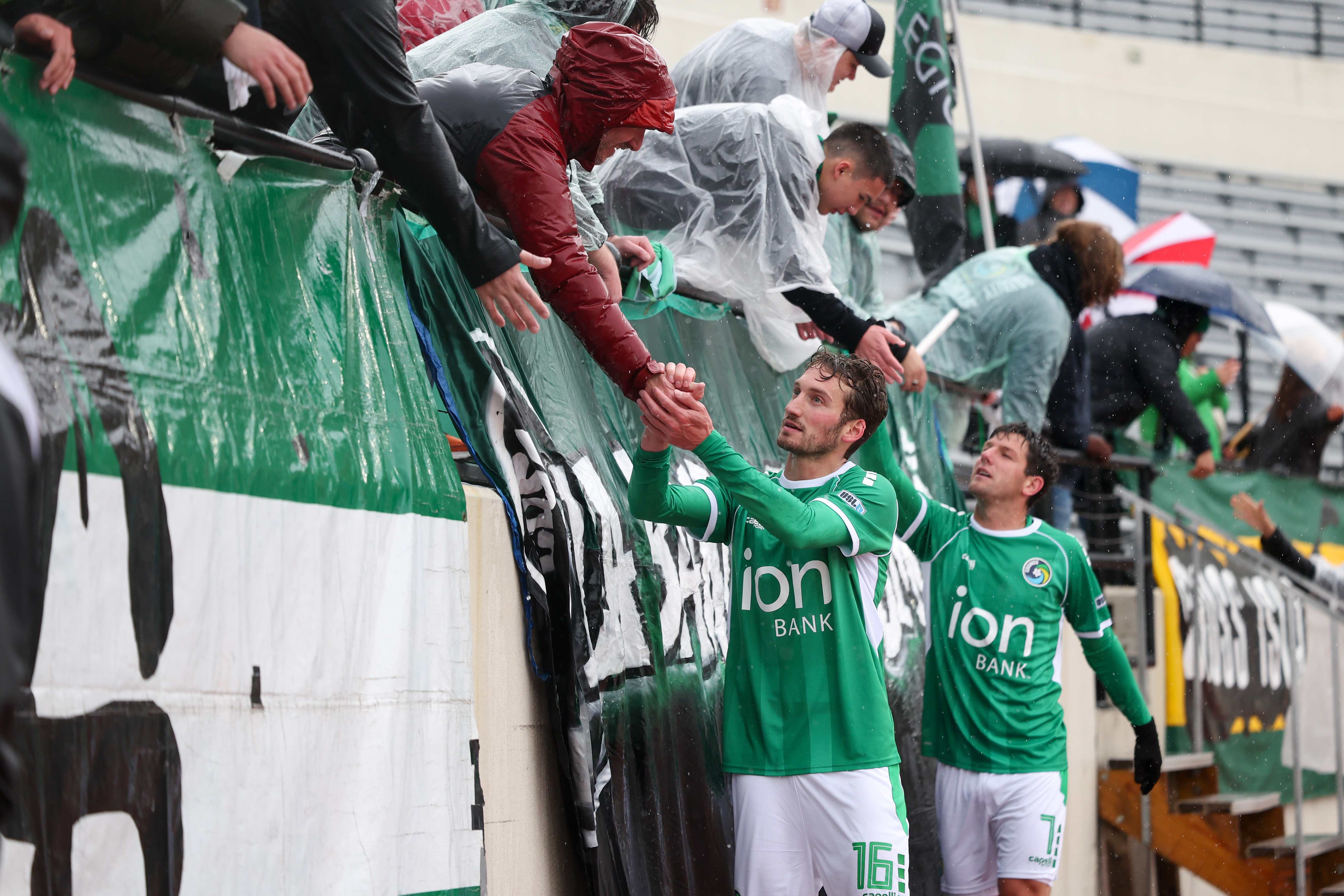 New York Cosmos pair Davey Mason and Eligio Guarino thank their fans at the end of the game