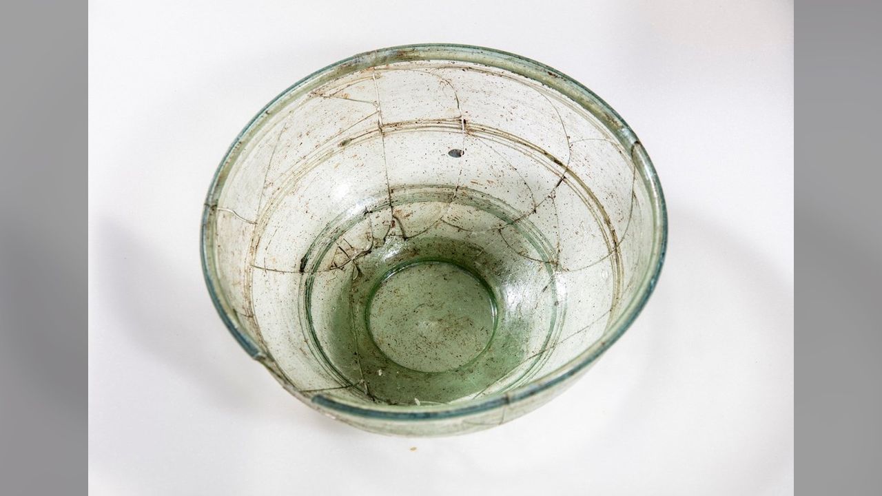 This is a simple bowl of pale green glass that was found in an Anglo-Saxon grave. It has several cracks, but is still intact.