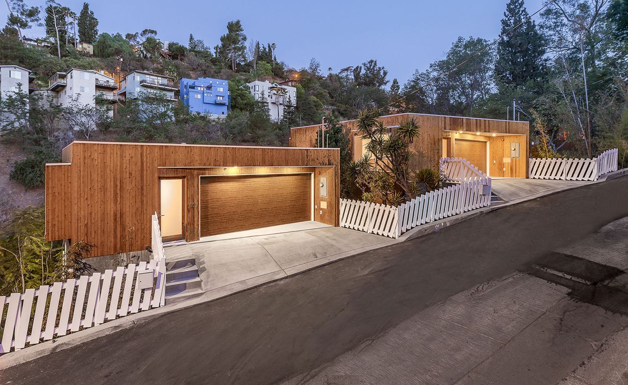 The identical Brother &amp; Sister Houses are built on adjacent plots.