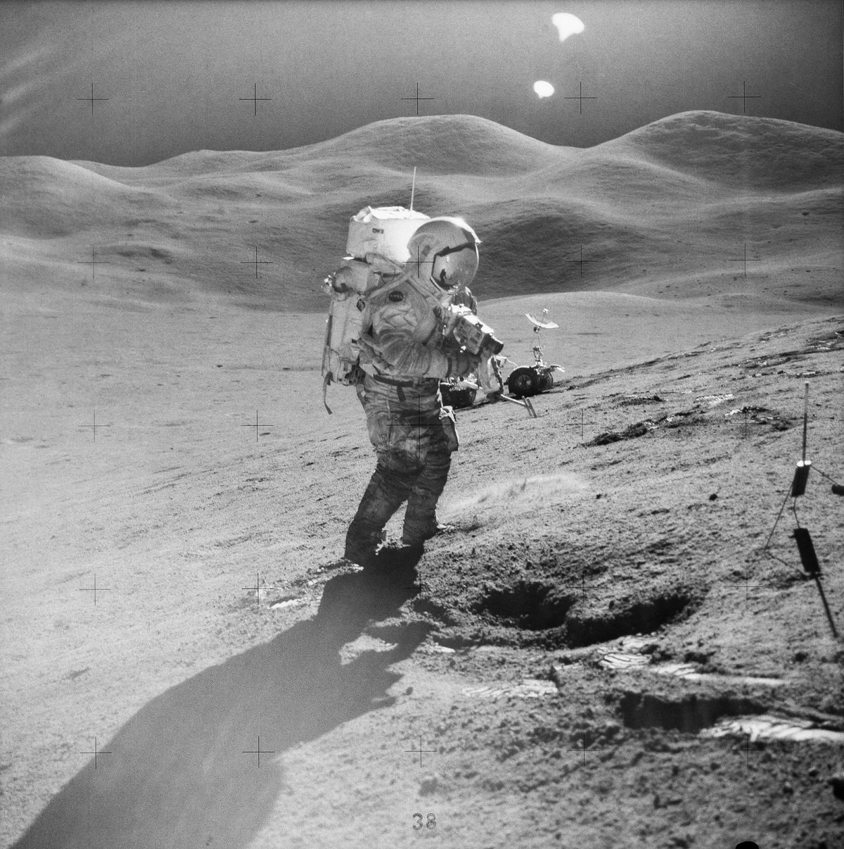 A photo of astronaut David R. Scott filming on the lunar surface as part of the Apollo 15 mission in 1971.