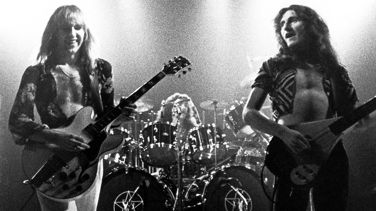 UNITED STATES - MAY 01: USA Photo of Geddy LEE and Alex LIFESON and RUSH, Alex Lifeson, Neil Peart & Geddy Lee performing live onstage on All The World's A Stage tour (Photo by Fin Costello/Redferns)