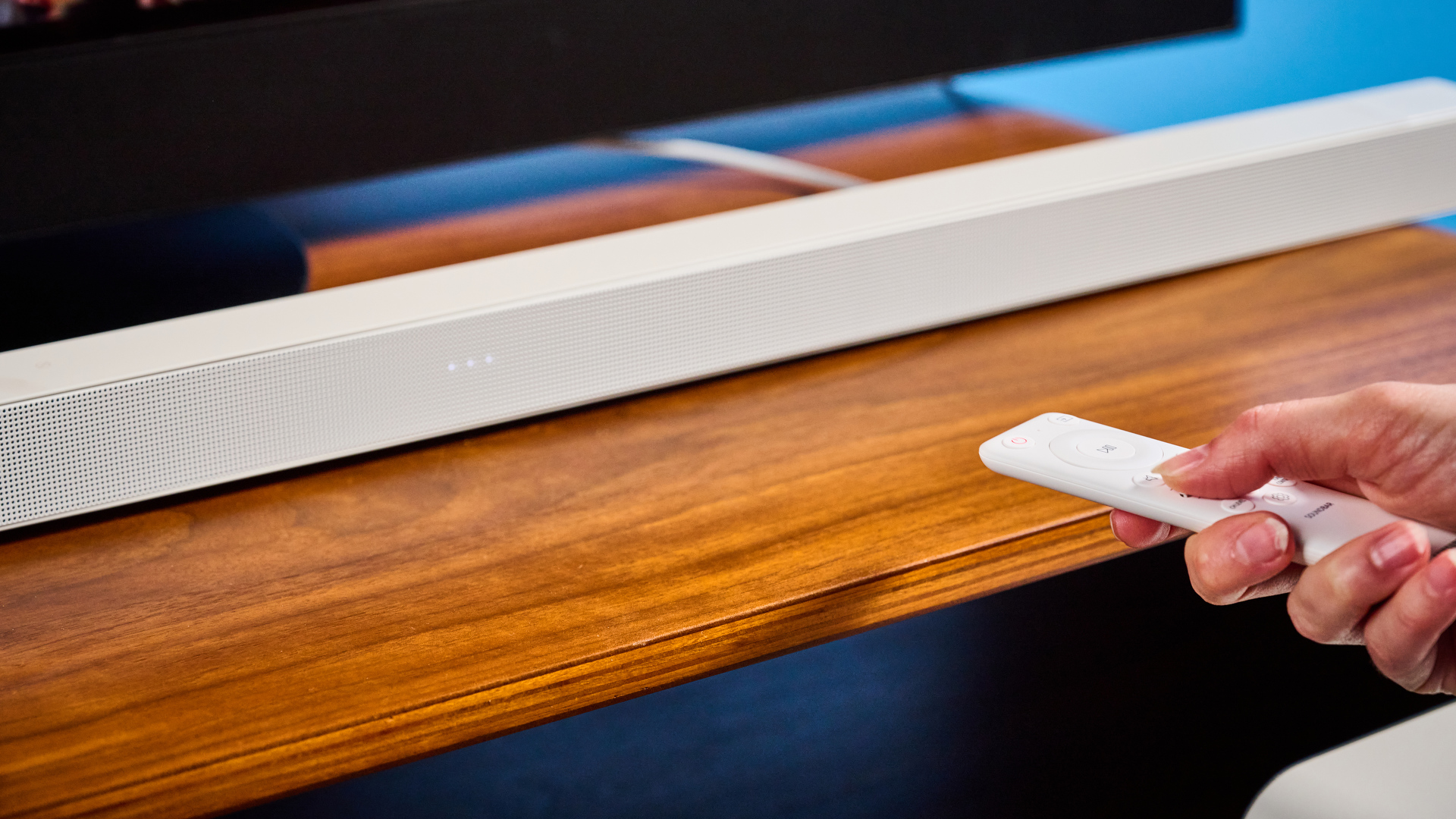 the samsung hw-s801d soundbar and subwoofer in white, an ultra slim soundbar with on-bar buttons, a remote, and separate subwoofer with a black cone