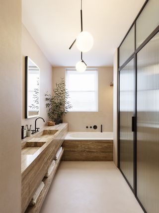 A bathroom with a light pink palette