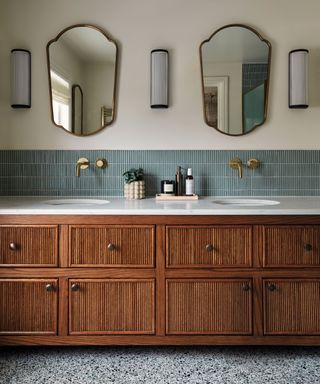 bathroom with wood paneled double vanity unity