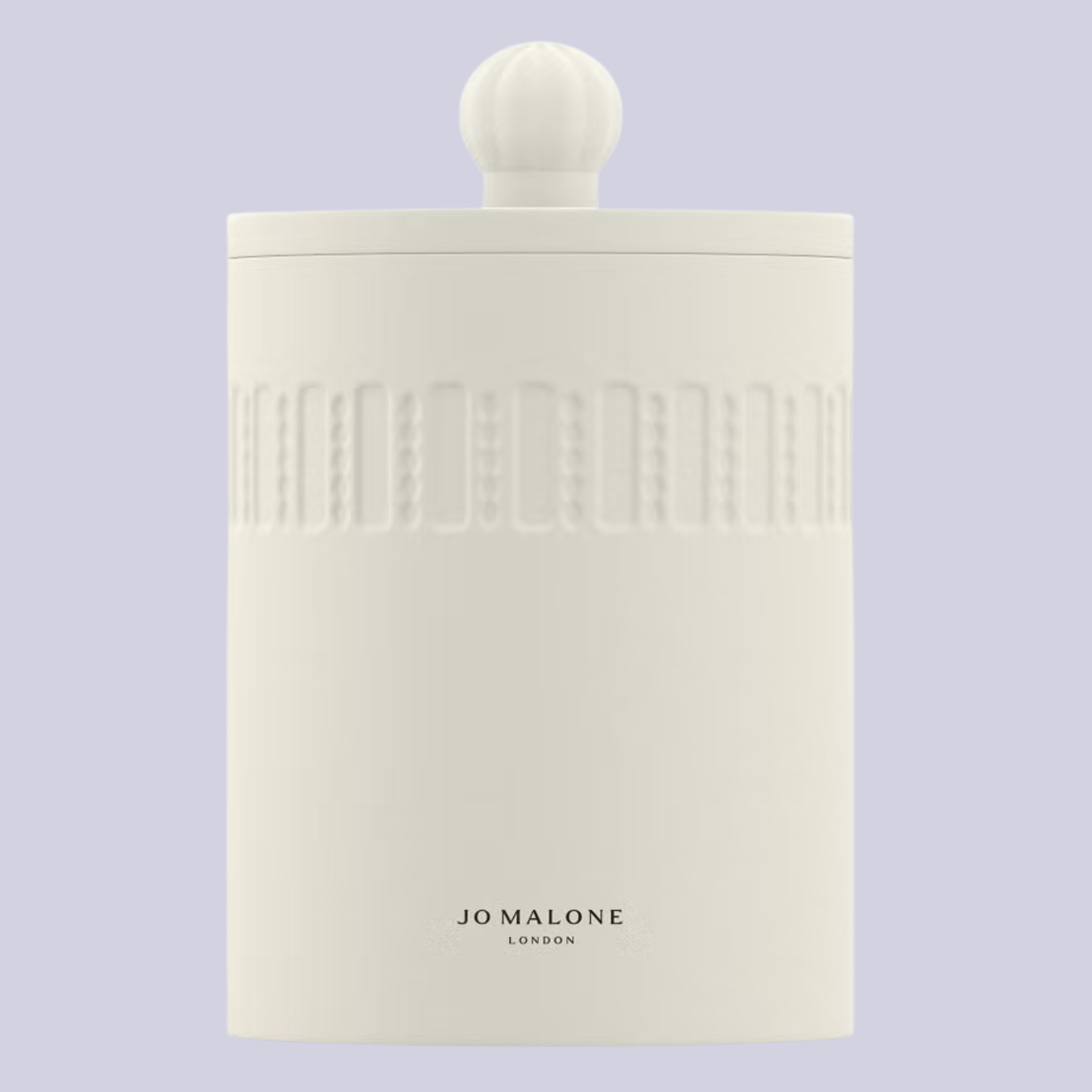 A white candle with a lid