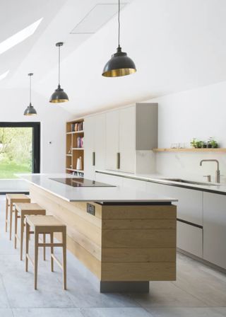 modern grey kitchen with long wooden island