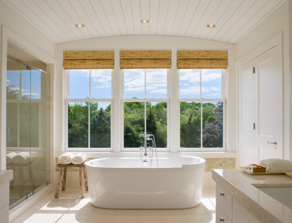 A bathroom with woven blinds