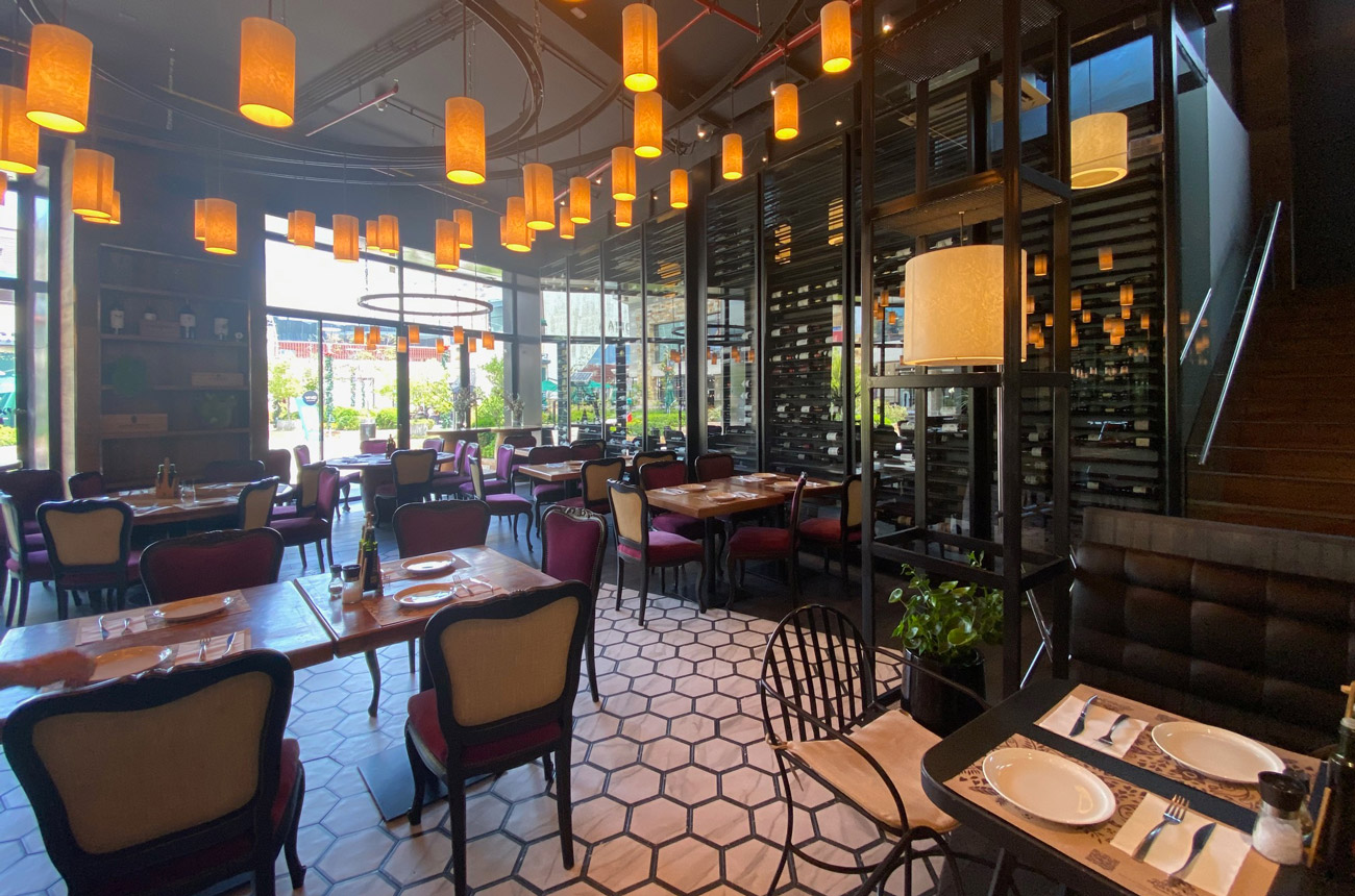 Tables and chairs in a restaurant with a tiled floor