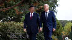 Xi Jinping and Joe Biden walking beside one another