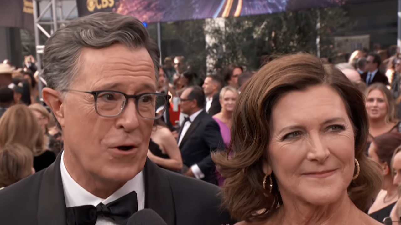 Stephen Colbert and wife Emma McGee-Colbert talking on 2025 Emmys red carpet.
