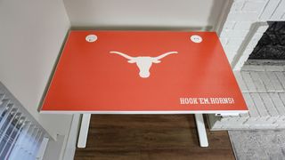 An overhead view of a University of Texas themed desk from the Uplift Desk Collegiate Collection