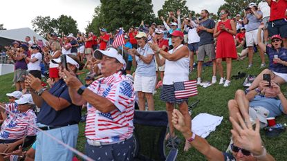  Fans cheer for Team United States on the 14th hole during the first round of the Solheim Cup 2024 at Robert Trent Jones Golf Club on September 13, 2024 in Gainesville, Virginia.