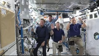 The four private astronauts of the Axiom Space Ax-1 mission to the International Space Station wave to students at Space Center Houston during a video call on April 13, 2022. They are (from left): Ax-1 pilot Larry Connor; commander and former NASA astronaut Michael López-Alegría; Canadian entrepreneur Mark Pathy; and Israeli entrepeneur Eytan Stibbe.