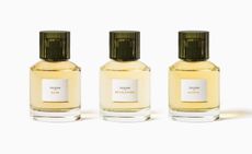 Three bottles of fragrance in a row 