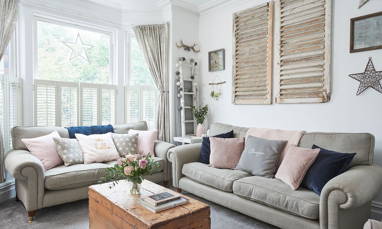 living room with sofaset and white walls