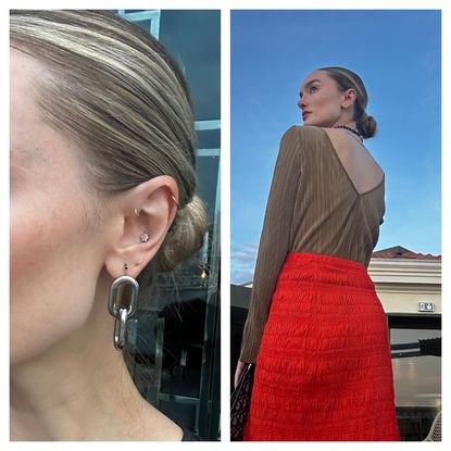 hannah baxter in a red skirt with a slick-back bun