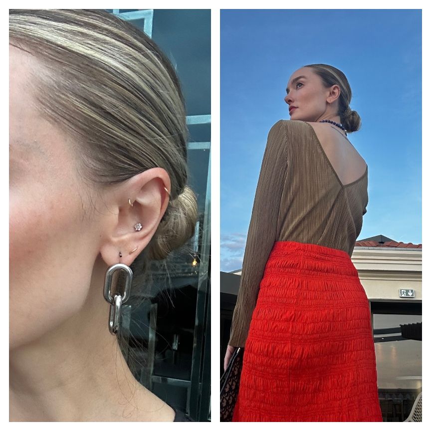 hannah baxter in a red skirt with a slick-back bun
