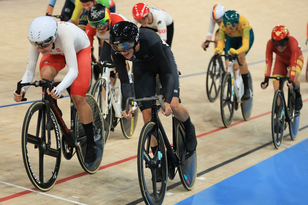 Poland's Daria Pikulik (L) cycles ahead of New Zealand's Ally Wollaston (R) for second and third place consecutively, in the women's track cycling omnium points race of the Paris 2024 Olympic Games at the Saint-Quentin-en-Yvelines National Velodrome in Montigny-le-Bretonneux, south-west of Paris, on August 11, 2024. (Photo by Emmanuel DUNAND / AFP)
