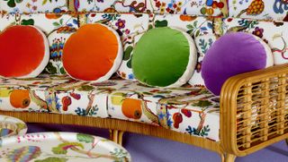 Patterned sofa with colourful cushions, part of India Mahdavi Svenskt Tenn exhibition during Stockholm Design Week 2022