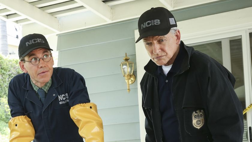 Gibbs and Jimmy (wearing long yellow gloves) looking down at a hot tub at a crime scene in NCIS