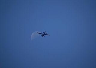 Moon and Propeller Plane Over France