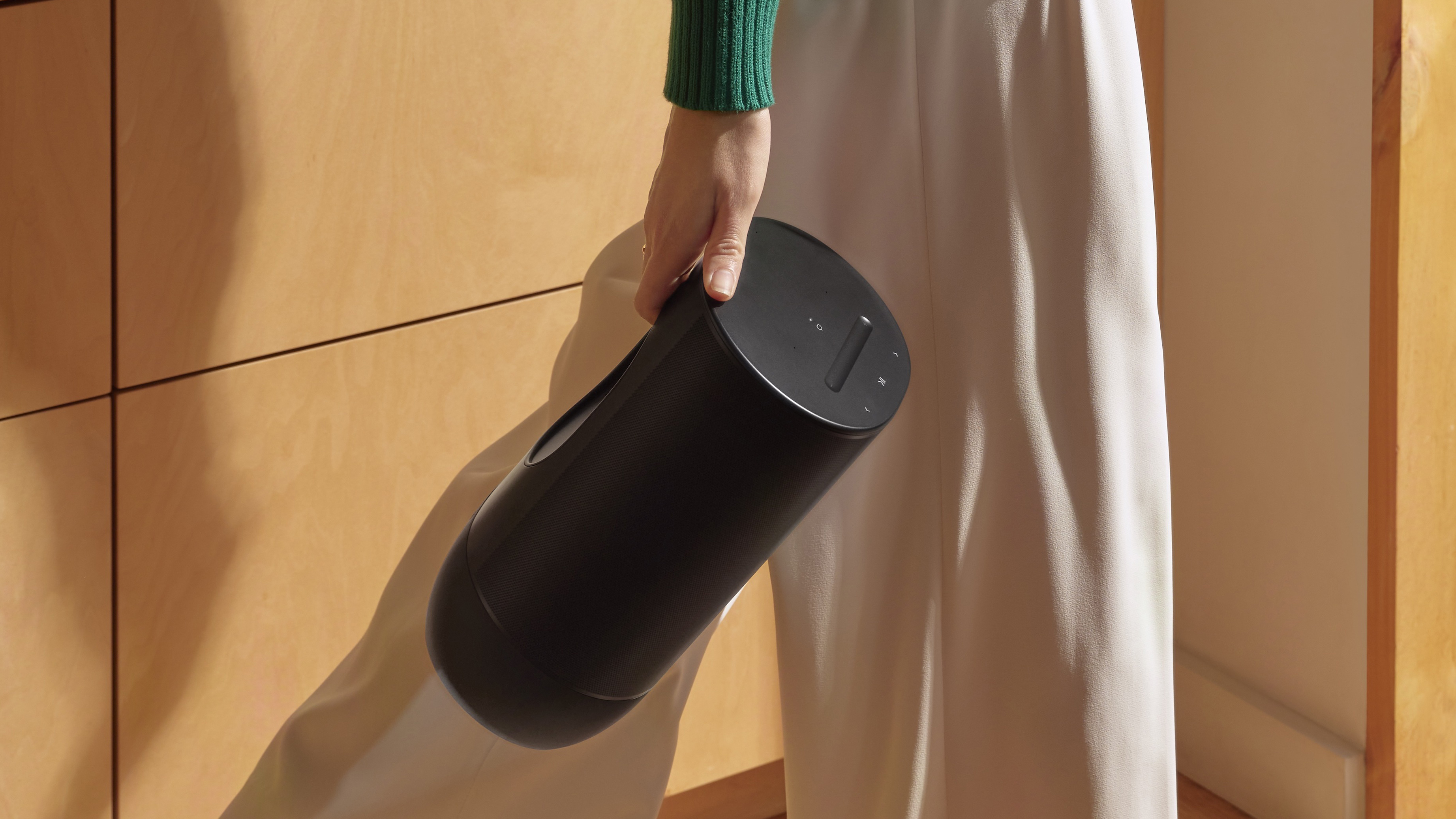 Sonos Move 2 being carried by a woman in a house