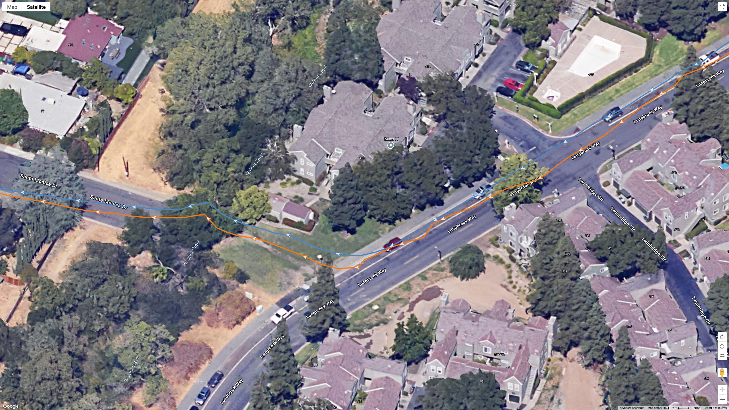 A Google Maps satellite view showing how the Polar Vantage M3 (orange line) and Garmin Fenix 8 (blue line) compared for GPS accuracy during a run.