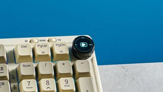 A beige, brown and off-white Epomaker RT100 wireless mechanical keyboard