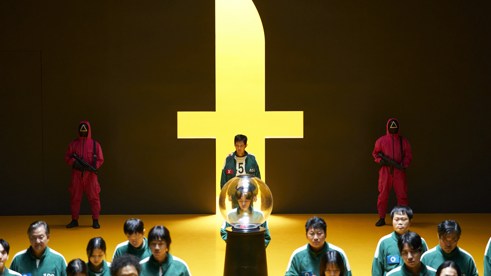 Gi-hun walking through a knife-shaped archway to join his fellow contestants in Squid Game season 3