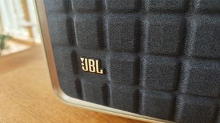 JBL Authentics 300 wireless speaker close up on logo and 'waffle' grille