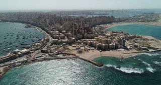 Aerial drone shot over Egypt Alexandria City coastline.