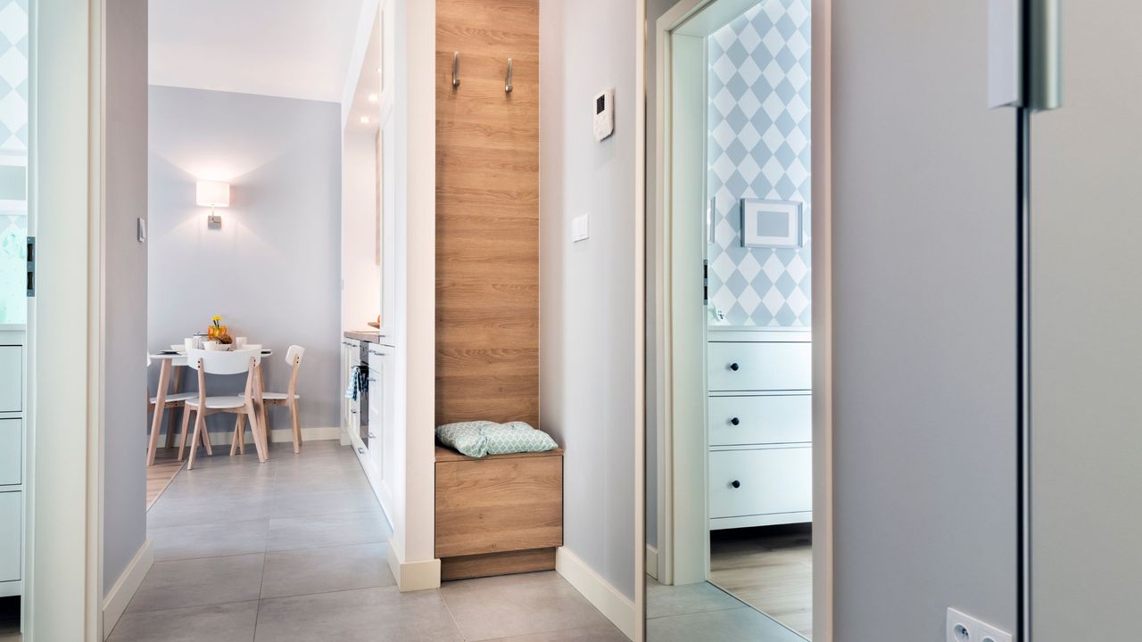 Hallway in a home with wood and white accents