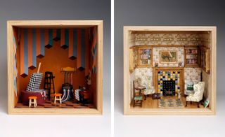 Two side-by-side photos of artistic interpretations of a dolls’ house in square, wooden boxes by several London-based design studios. The first box features stools, a ladder, a sewing machine, a rolling press machine, 3D cube patterned flooring and rust coloured walls with an optical illusion style pattern. And the second box features light coloured floral wallpaper, wood flooring, three armchairs, a rug, a wooden and tiled fireplace, framed wall art, a table, a wooden chair and wall-mounted shelving