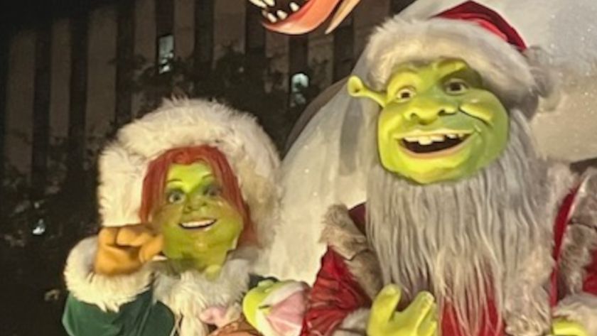 Shrek and Fiona smile during the Universal Orlando Holiday Parade.