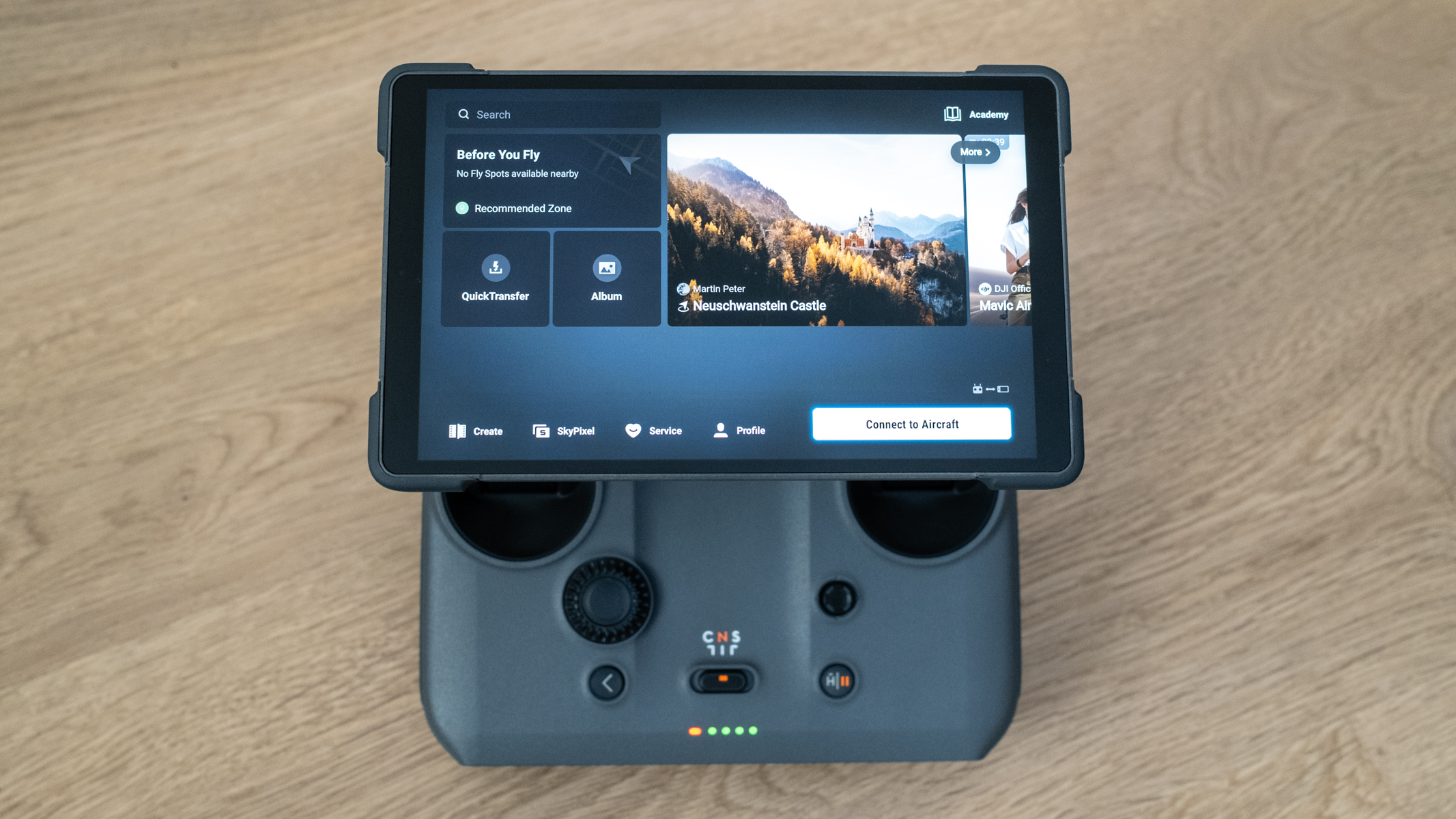DJI RC 2 smart controller on a wooden floor