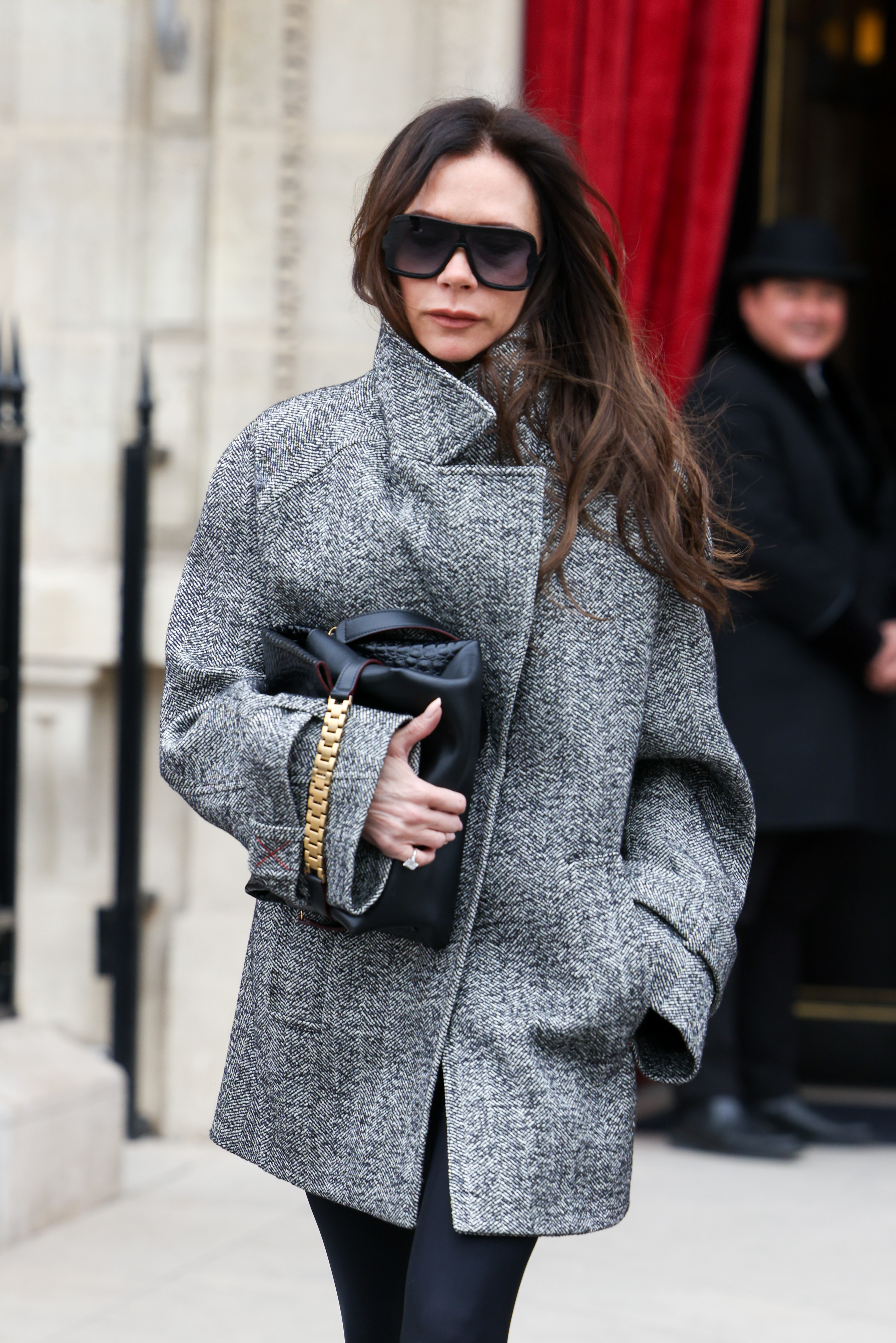 An image of Victoria Beckham wearing one of the best clutch bags.