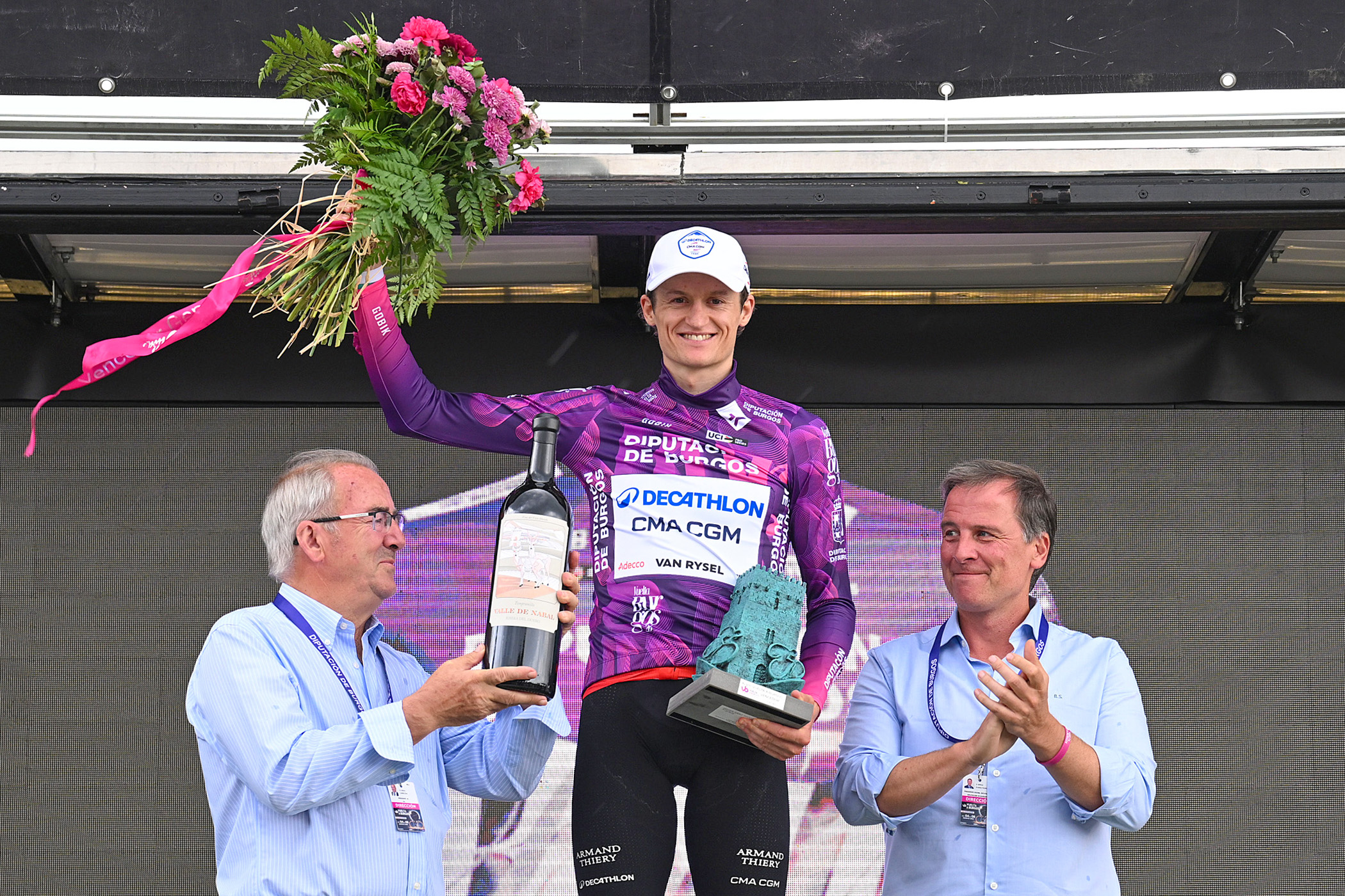 Felix Gall celebrates on the podium as overall race winner at the Vuelta a Burgos